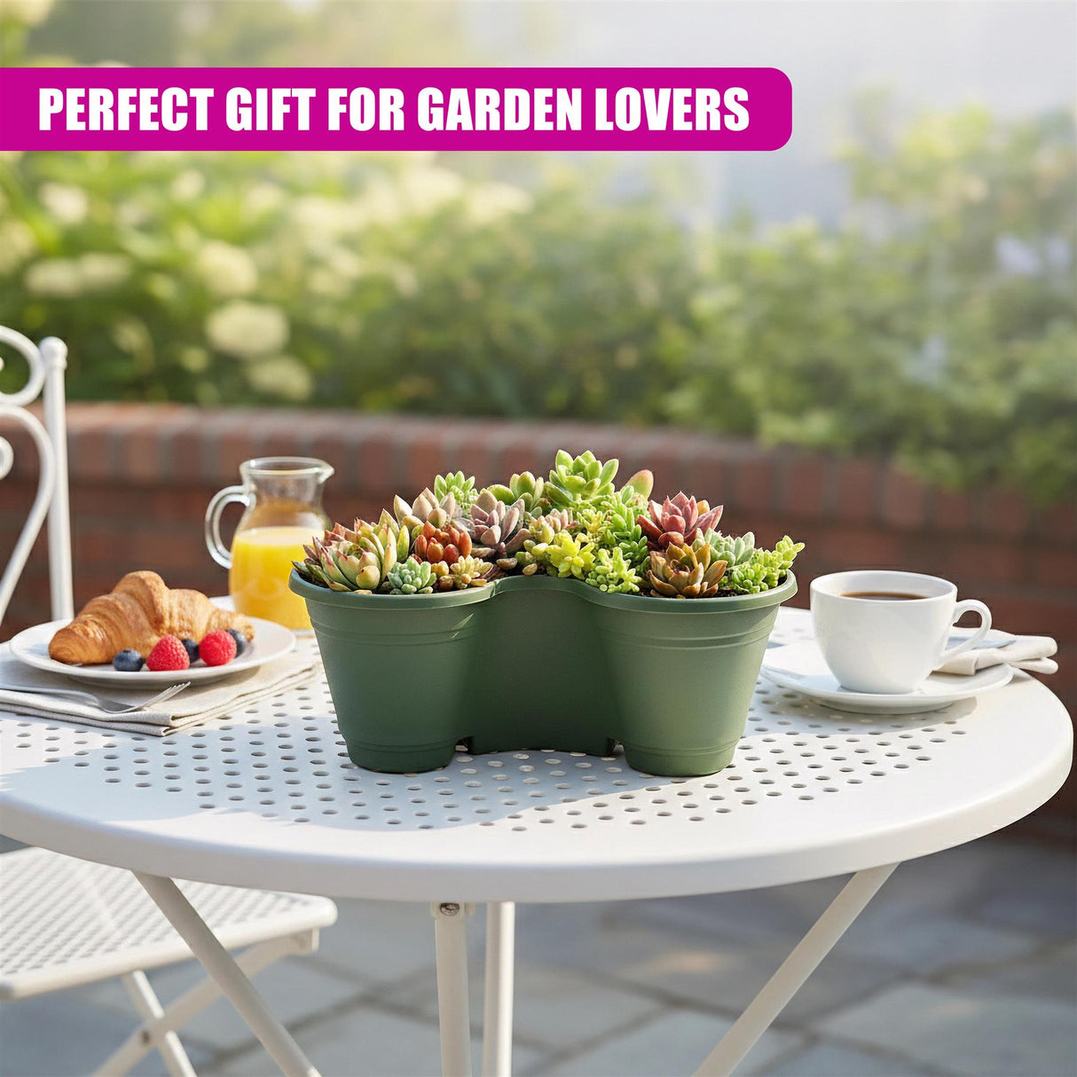 Three dark green, curved planters filled with colorful succulents rest on a white table.