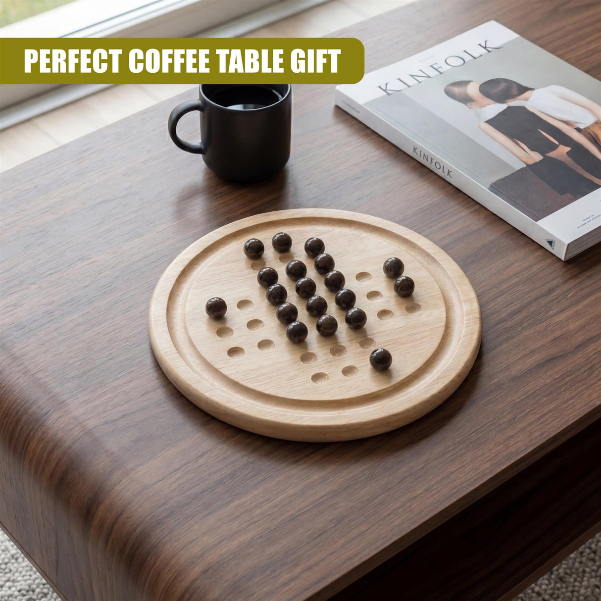 Wooden solitaire game board with recessed holes and several dark wood playing pieces arranged upon it.