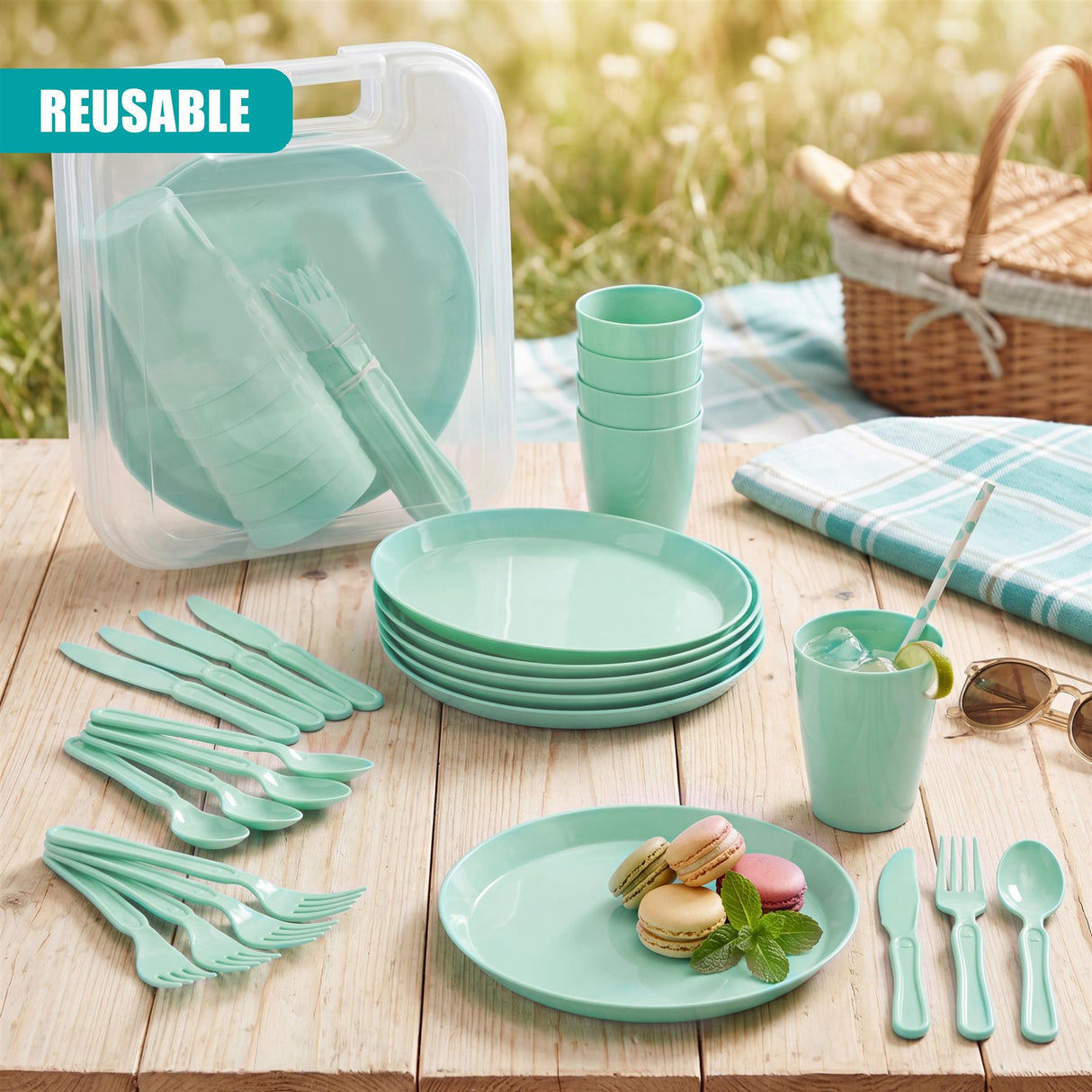 Assorted mint green plates, bowls, cups, and cutlery are arranged on wood, displayed next to a storage case.