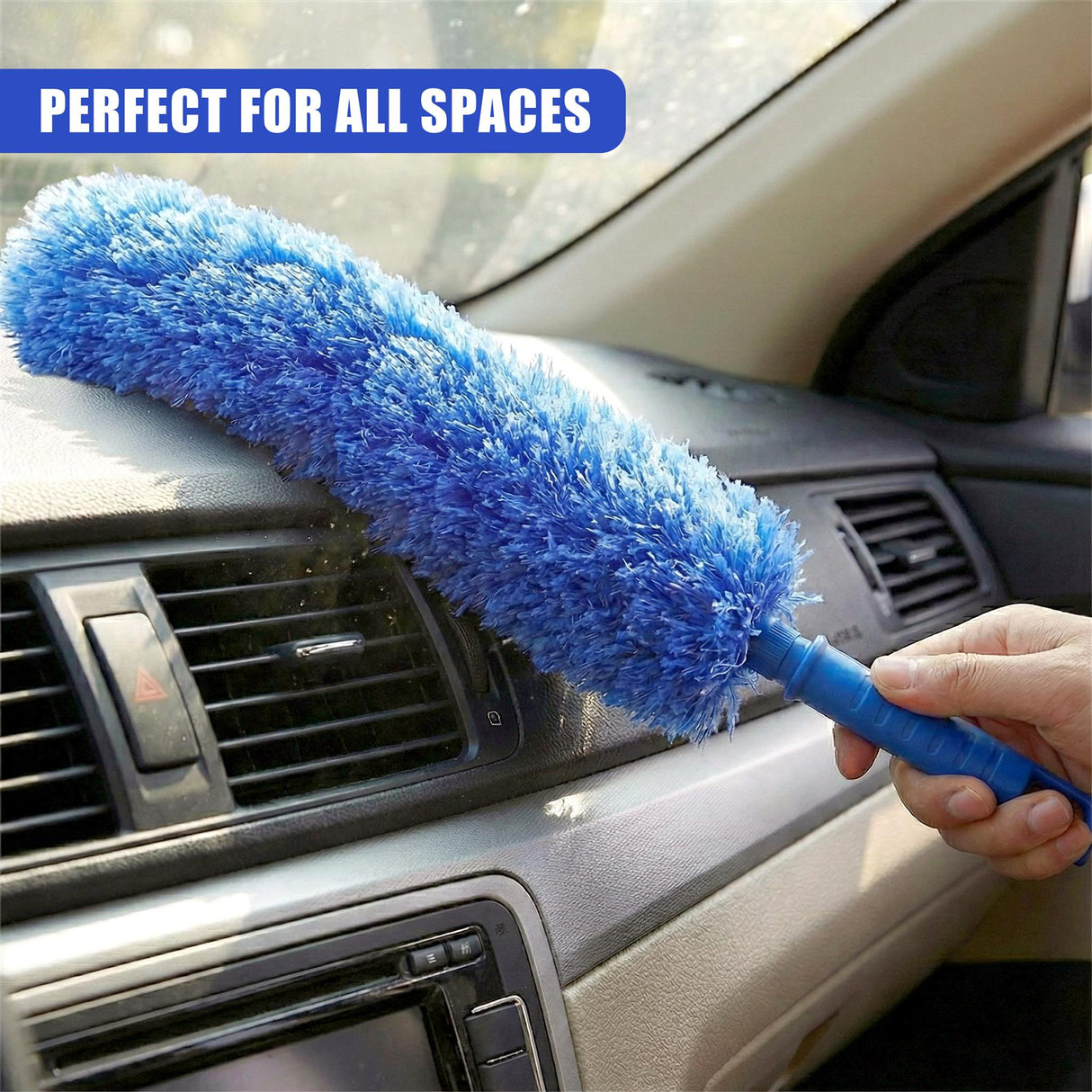 Hand using a bright blue extendable brush on the car's interior air vent and dashboard.