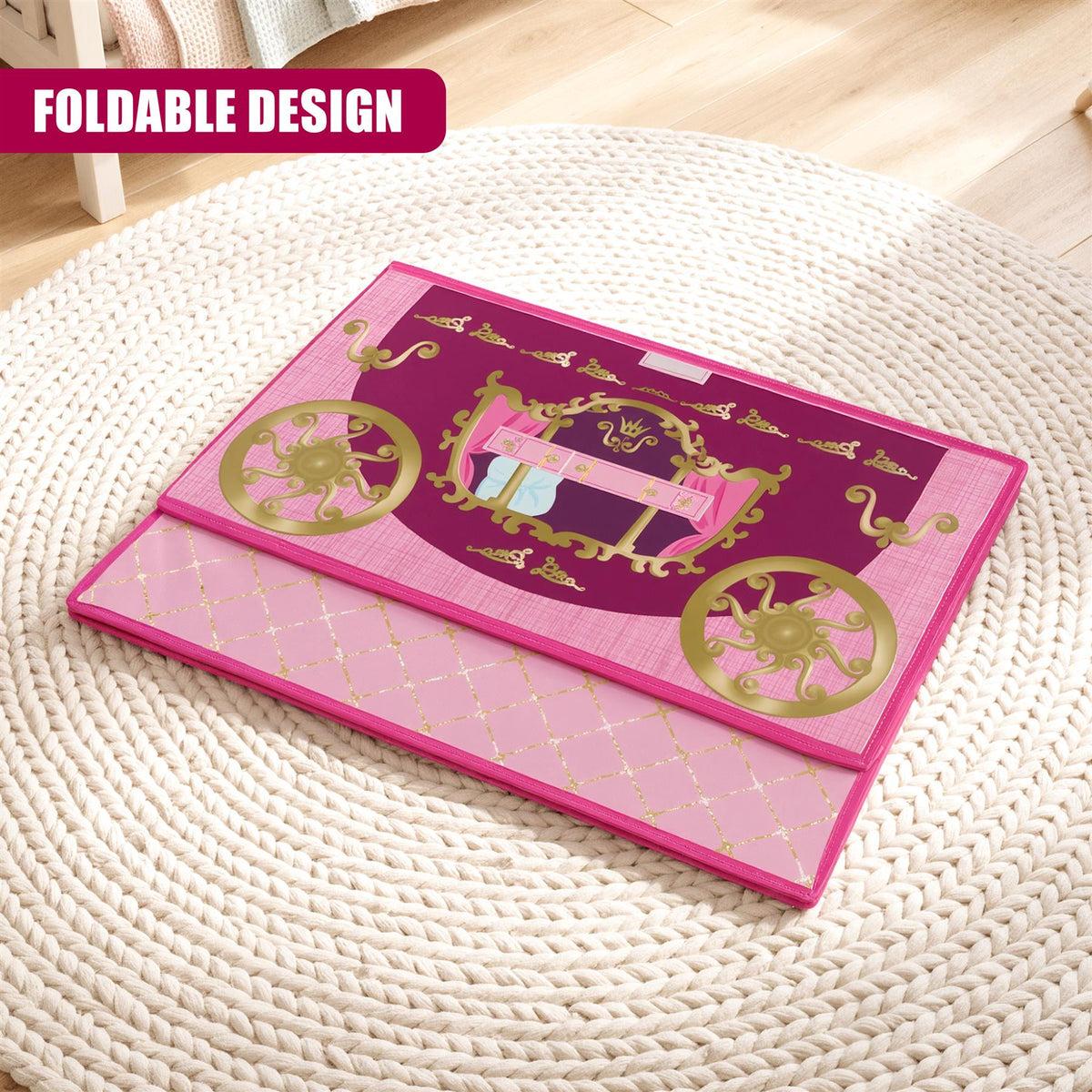 A pink and purple foldable toy storage box with a princess carriage design sits on a white woven mat