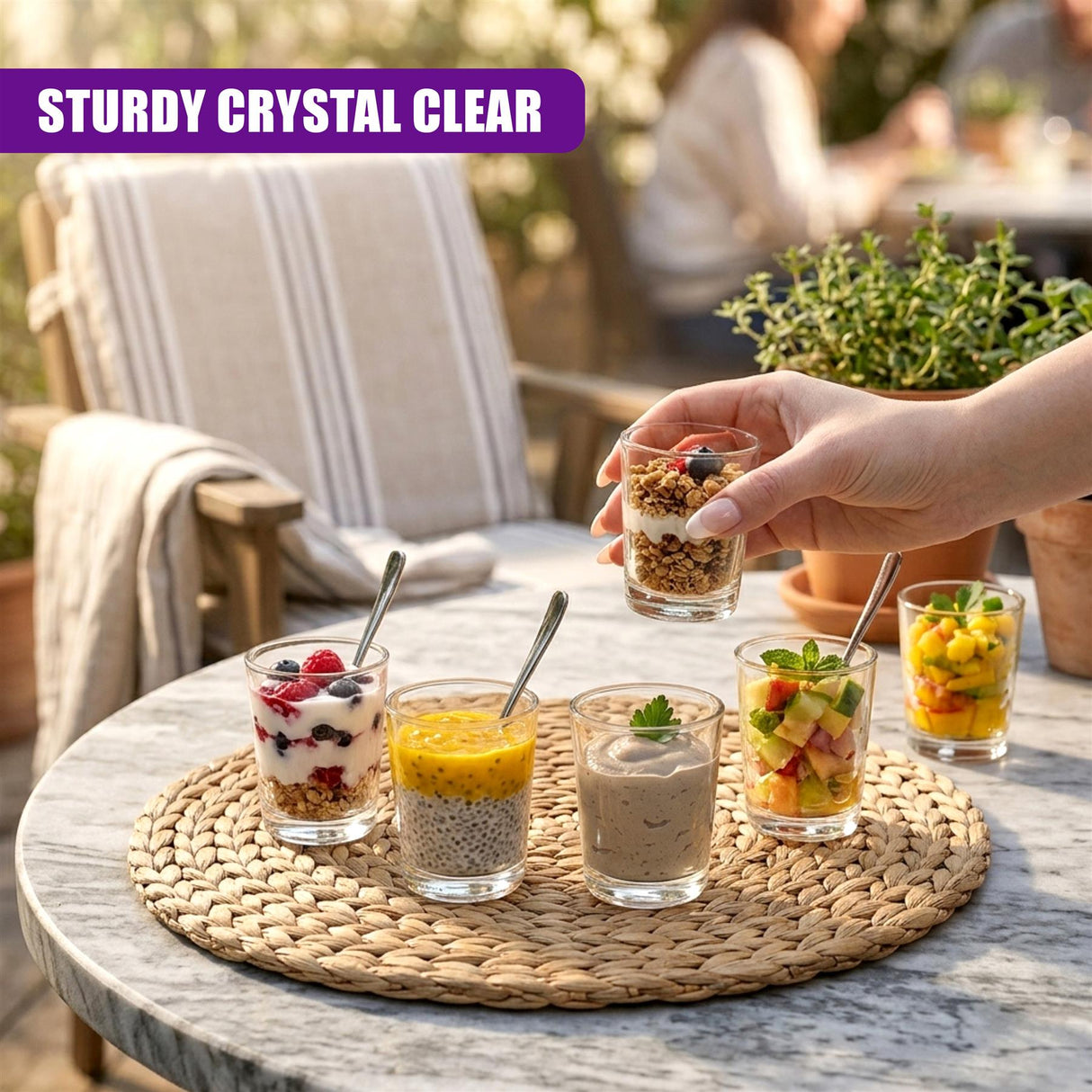 Shot glasses holding miniature desserts, showcasing fruit, yogurt, and layered fillings.