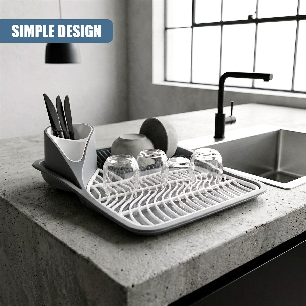 White dish drying rack holding glassware and utensils arranged on a countertop.