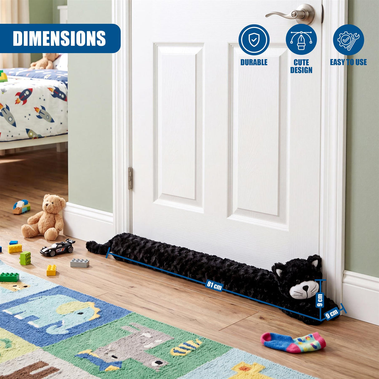 Black, plush, cat-shaped draught excluder placed along the base of a white interior door.