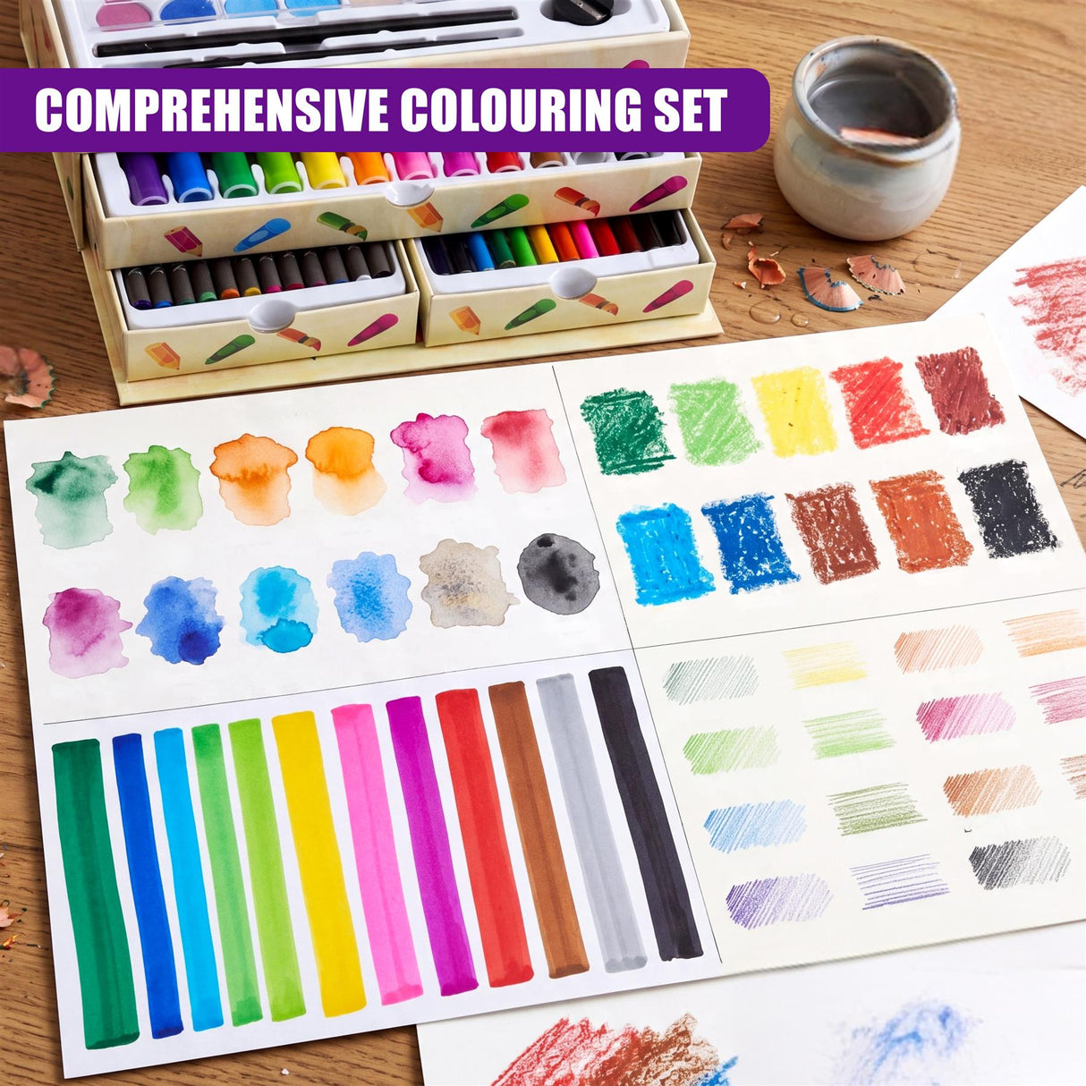 A wooden box of colored pencils rests near various sheets of paint and color gradient swatches.