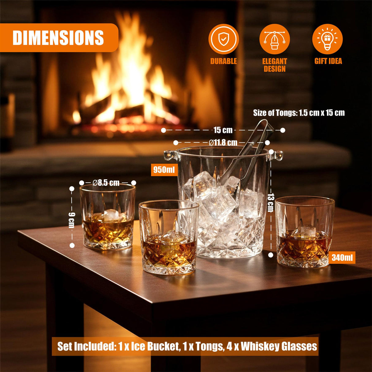A collection of four whiskey glasses, an ice bucket, and serving tongs arranged on a table.