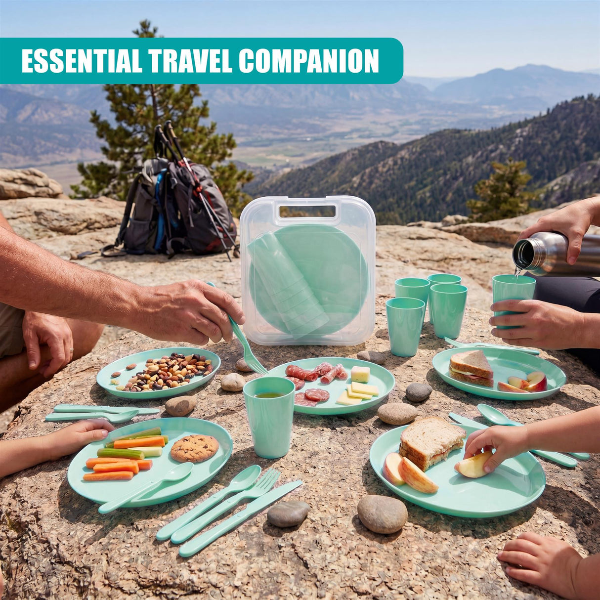 The green picnic set includes plates, cups, and utensils arranged with snacks and fruit on rocks.