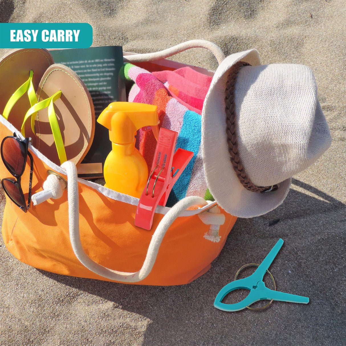 Several light blue plastic clips sit next to an orange beach tote filled with summer accessories.