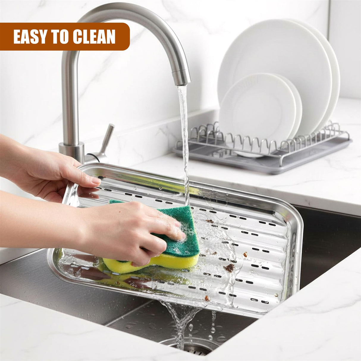 A person scrubs a slatted metal grill tray with a sponge under running faucet water.