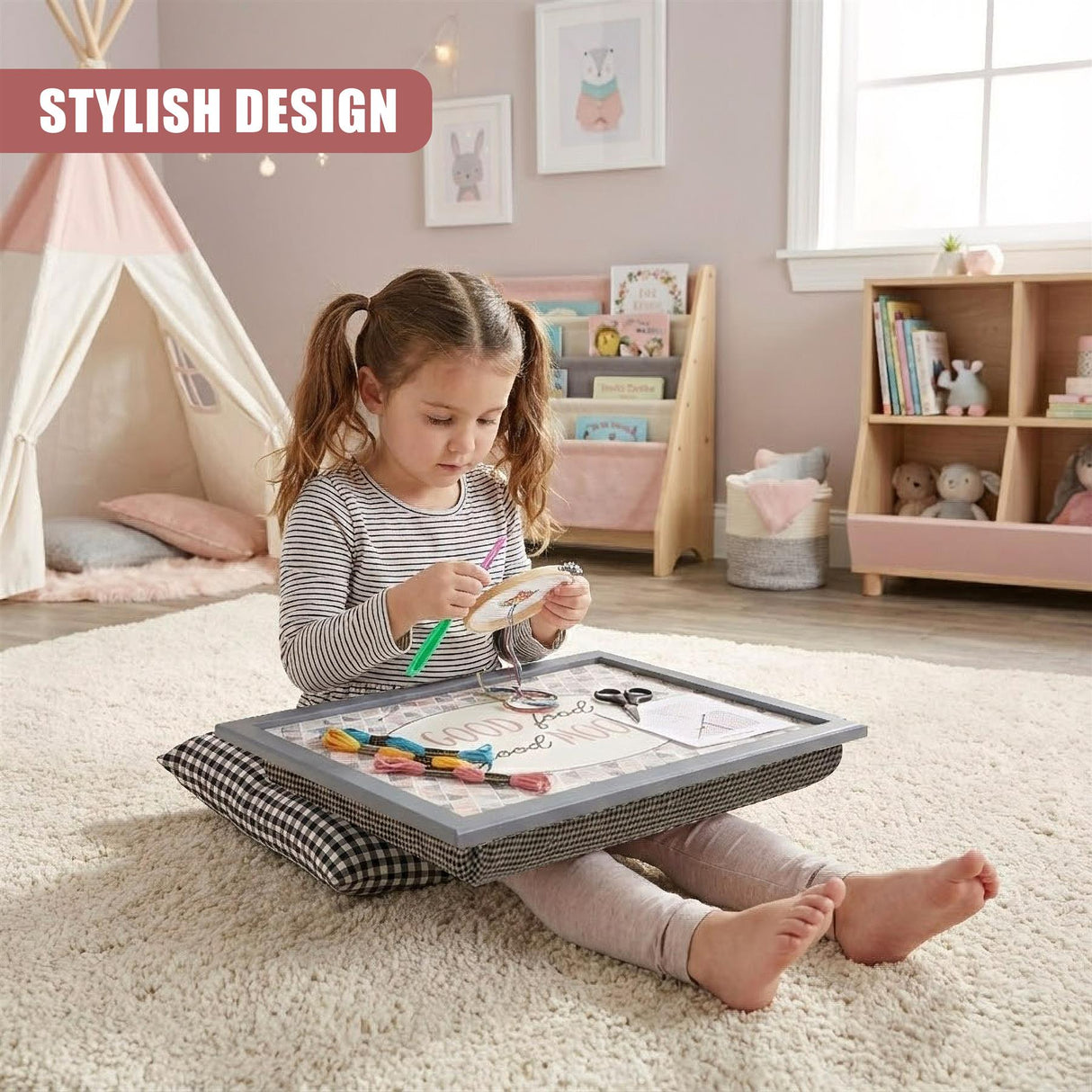 Young girl drawing with crayons on a patterned lap tray cushion resting on a rug.