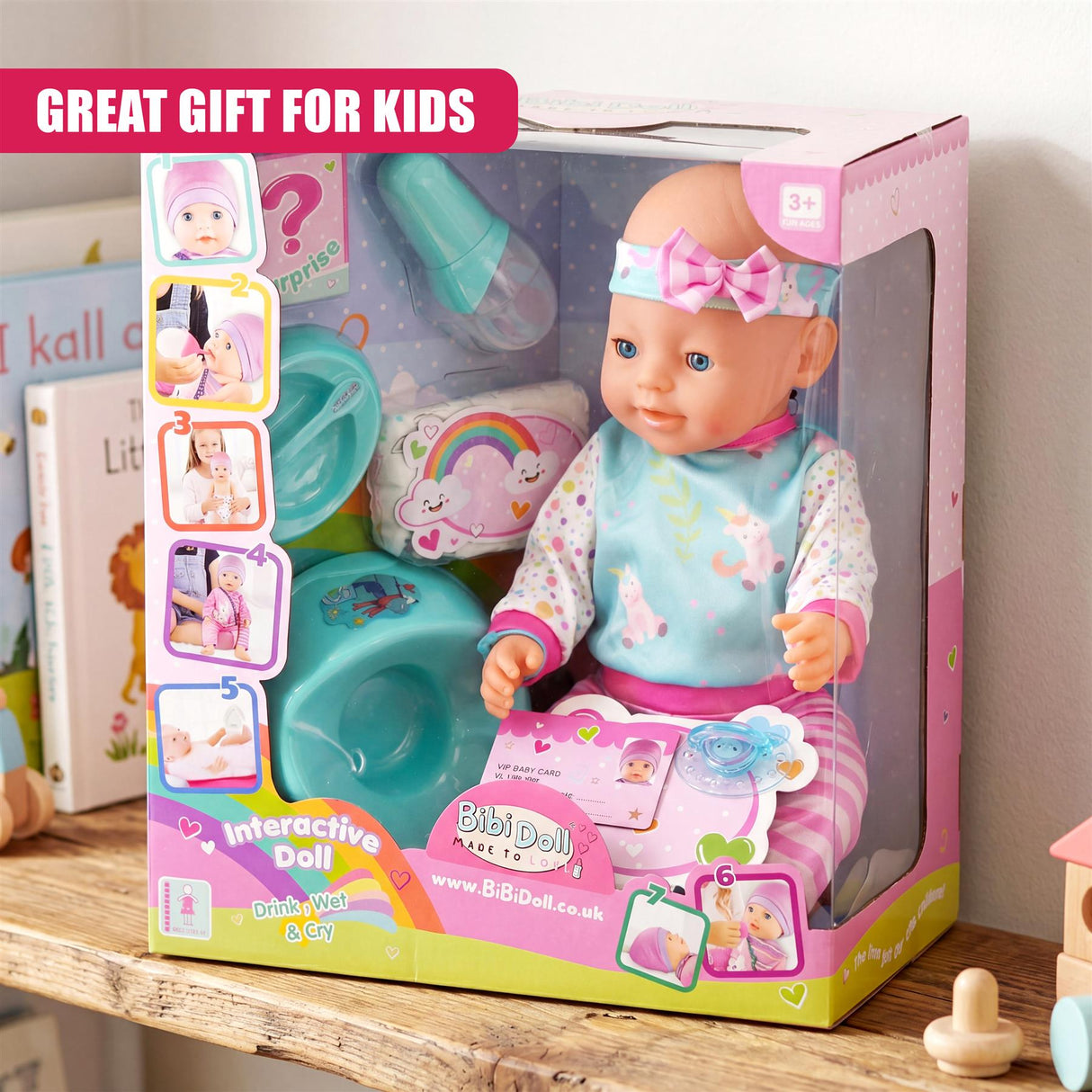 Doll playset box features a doll, a washbasin, and accessories, including bottles and a changing mat.