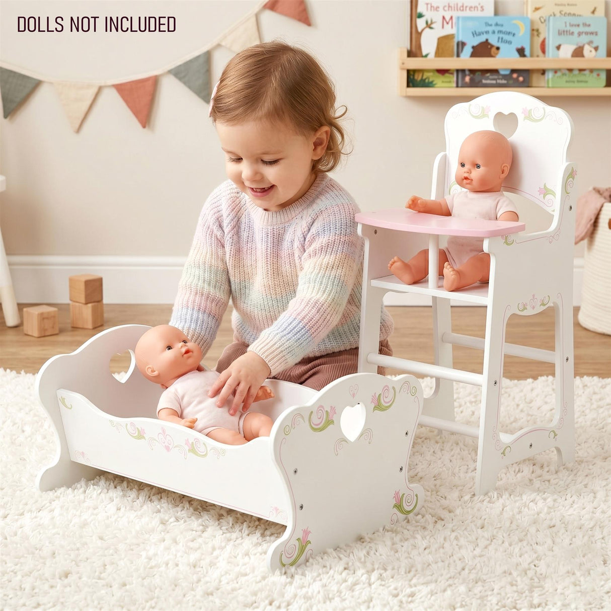 White wooden doll cradle and matching high chair set, shown with dolls near a child.