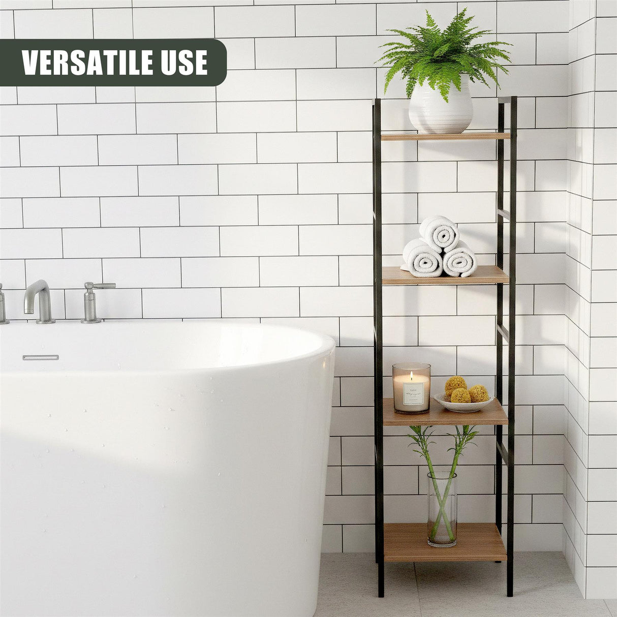 Four tiered black metal shelves display towels, soap, and greenery beside a white bathtub.