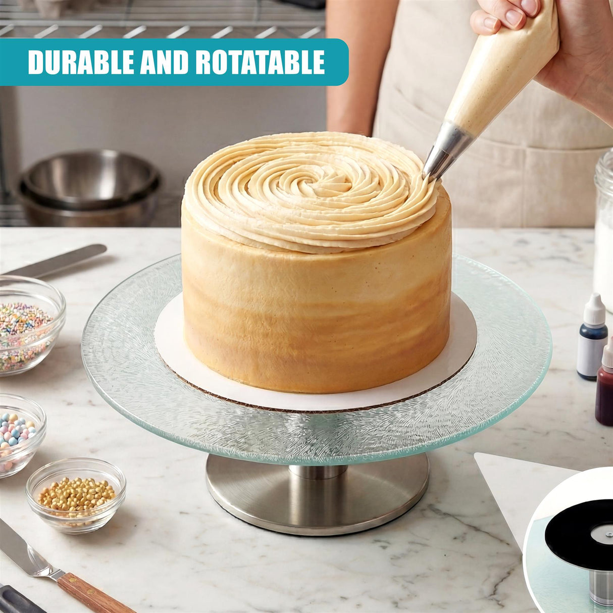Round cake on a glass stand; hand decorating the cake with a patterned spiral frosting motion.