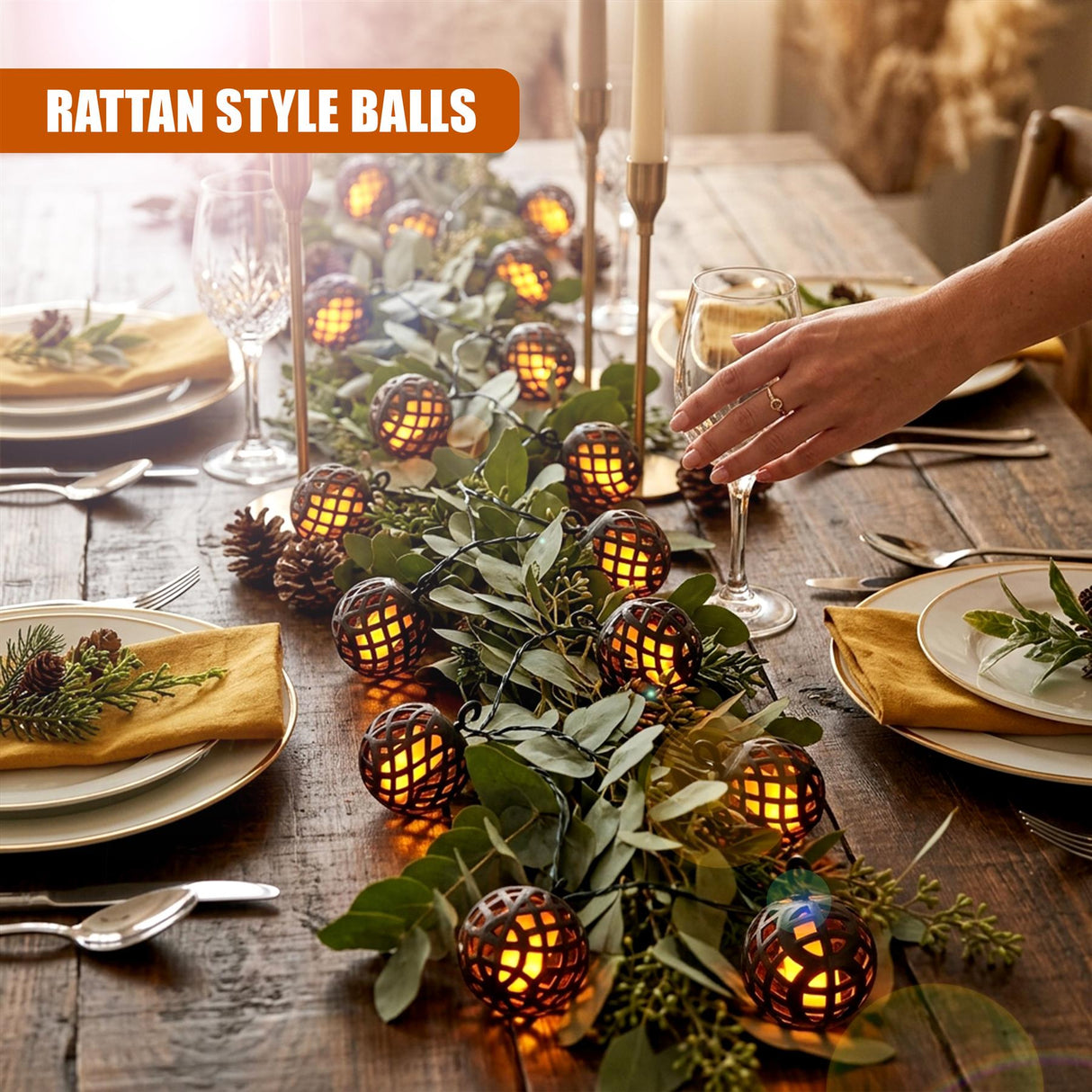 Solar string lights with rattan bulbs illuminate a wooden table setting with foliage and dishes.