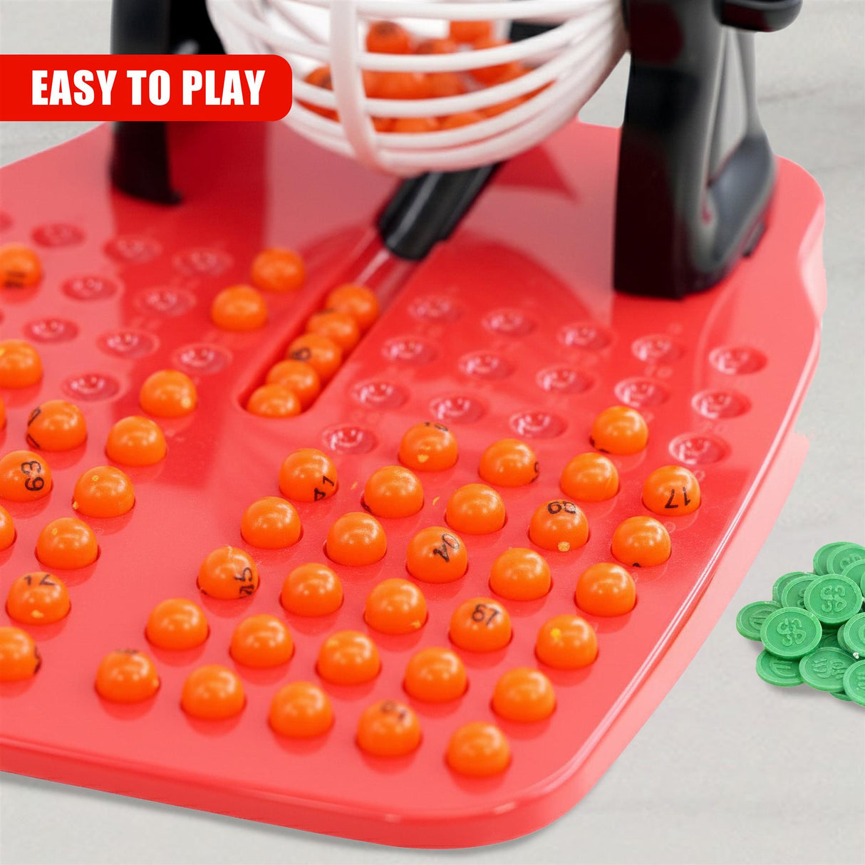 Red bingo game board features numbered red and orange plastic tokens.