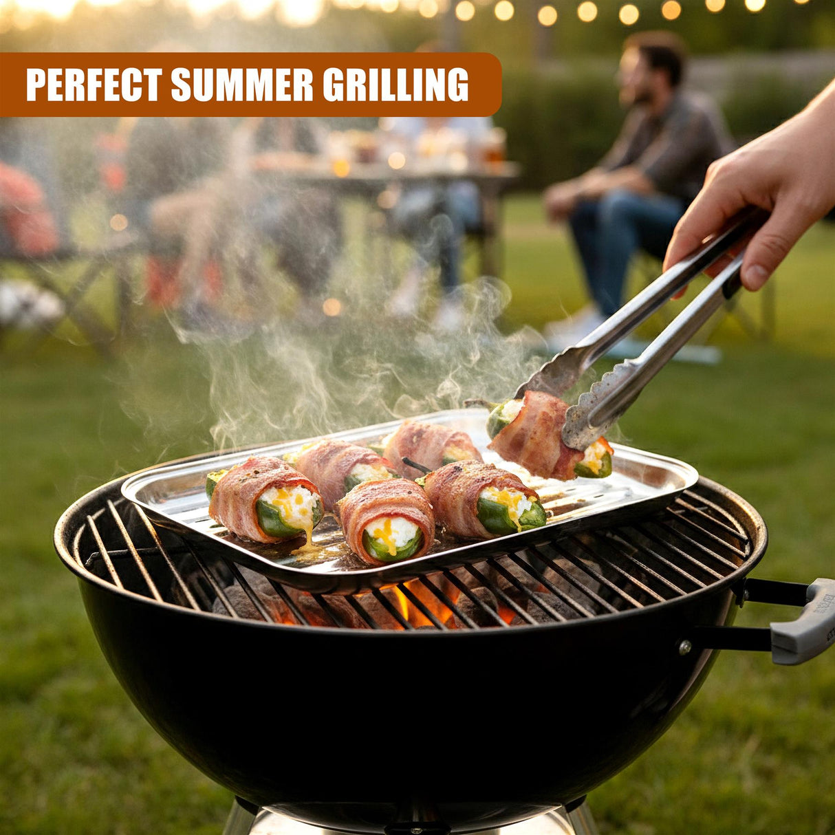 A metal tray holds cooked food rolls over the grate of a dark BBQ grill.