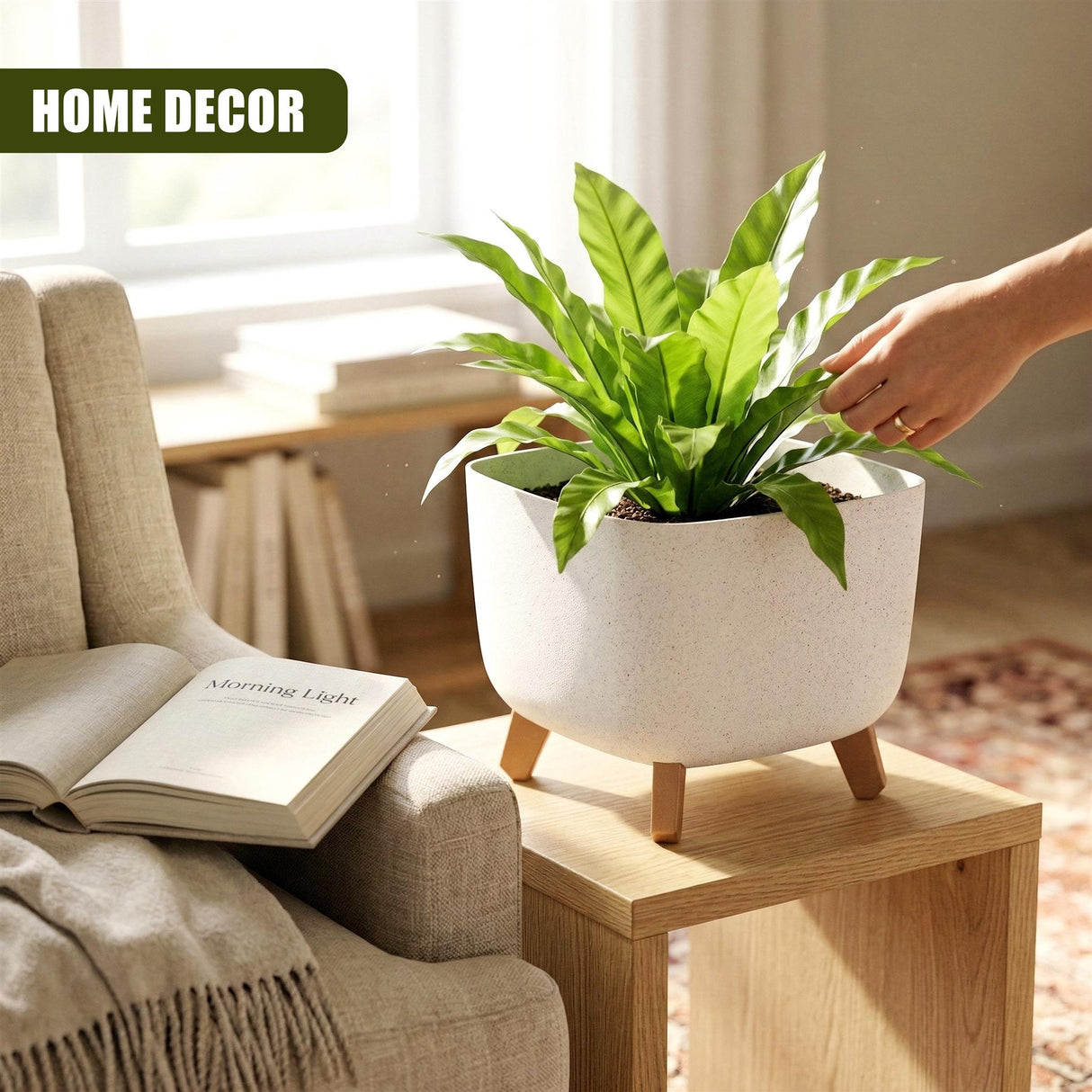 White ceramic flower pot with wooden legs displaying a large green potted plant on a wooden table.
