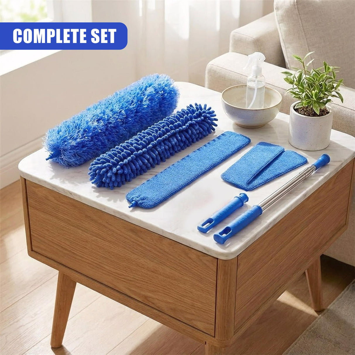 Blue dusting set featuring long microfiber cloths, a fluffy brush, and an extendable pole on a wooden table.