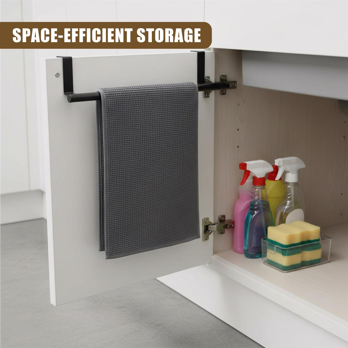 Towel on a door rail next to cleaning bottles and stacked soap bars inside cabinet.