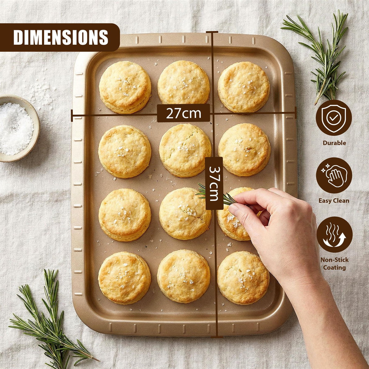 A rectangular baking tray filled with round, golden biscuits, with a hand reaching into the product.