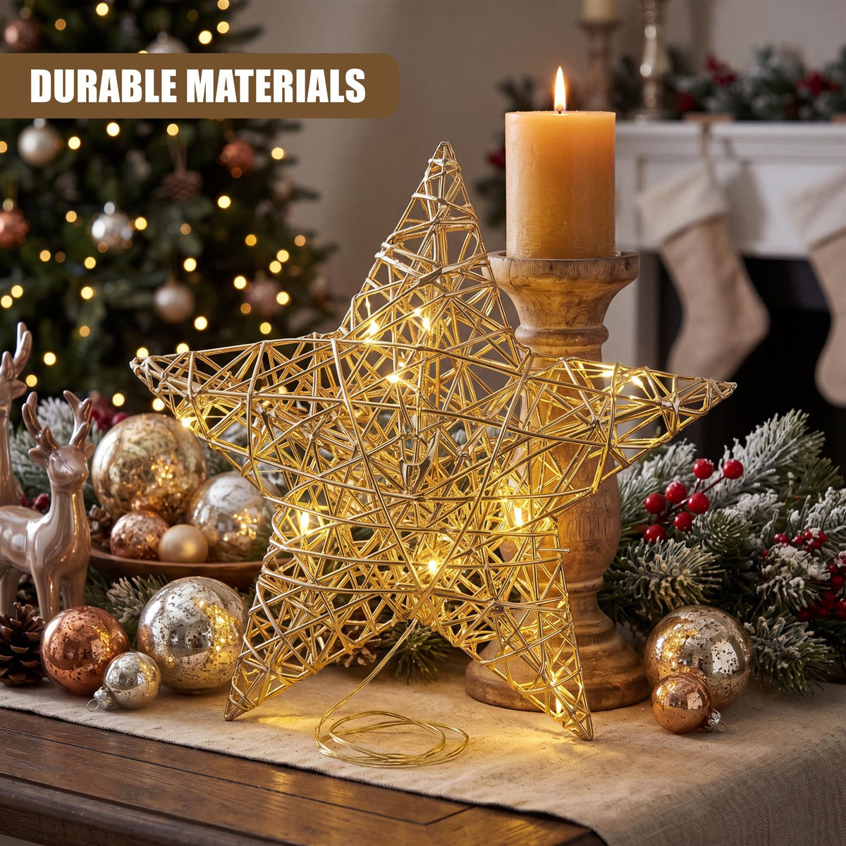 A champagne gold hanging LED Christmas star by GEEZY sits on a wooden surface surrounded by festive decorations including