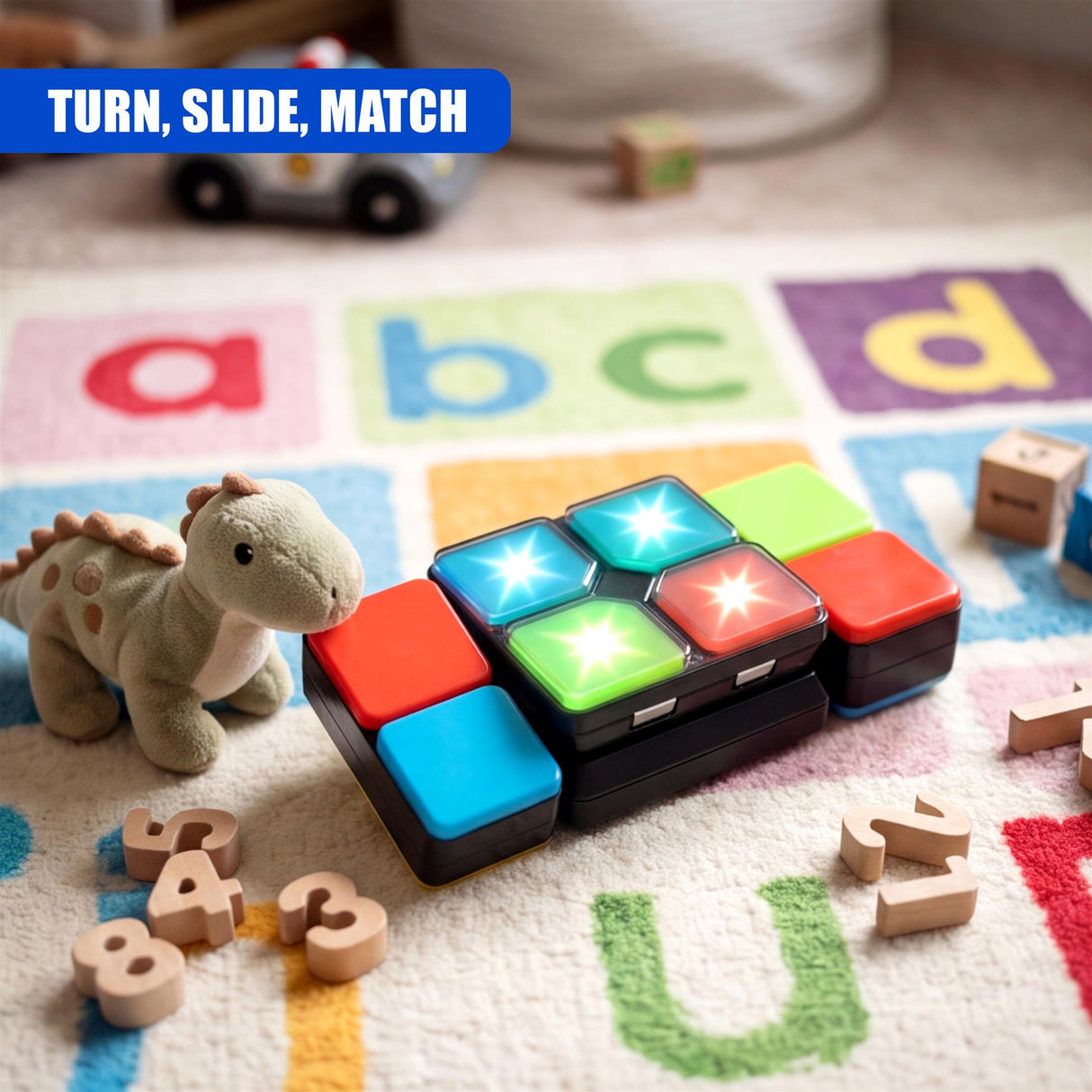 Black logic cube toy with colored, illuminated tiles rests on a colorful alphabet play mat.