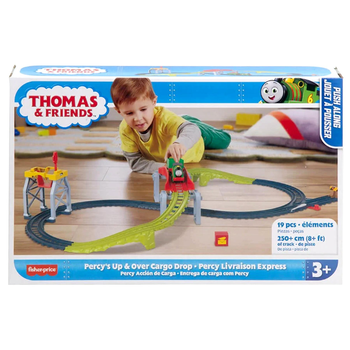 Building set featuring green and blue track, a yellow cargo drop, and a small train model.