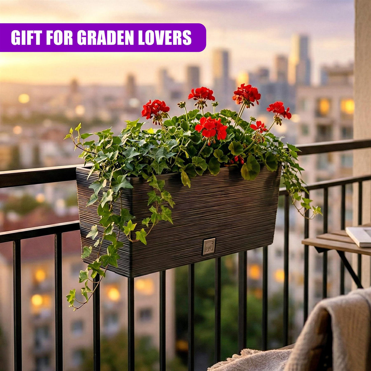 Rectangular planter filled with bright red flowers and lush green foliage displayed on a balcony railing.