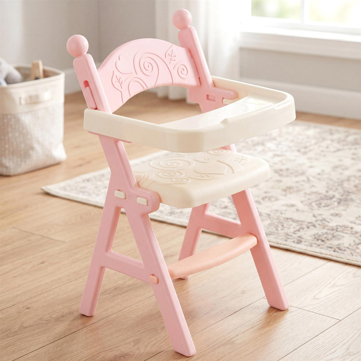 Pink high chair toy with bib and matching feeding doll is shown on a light rug.