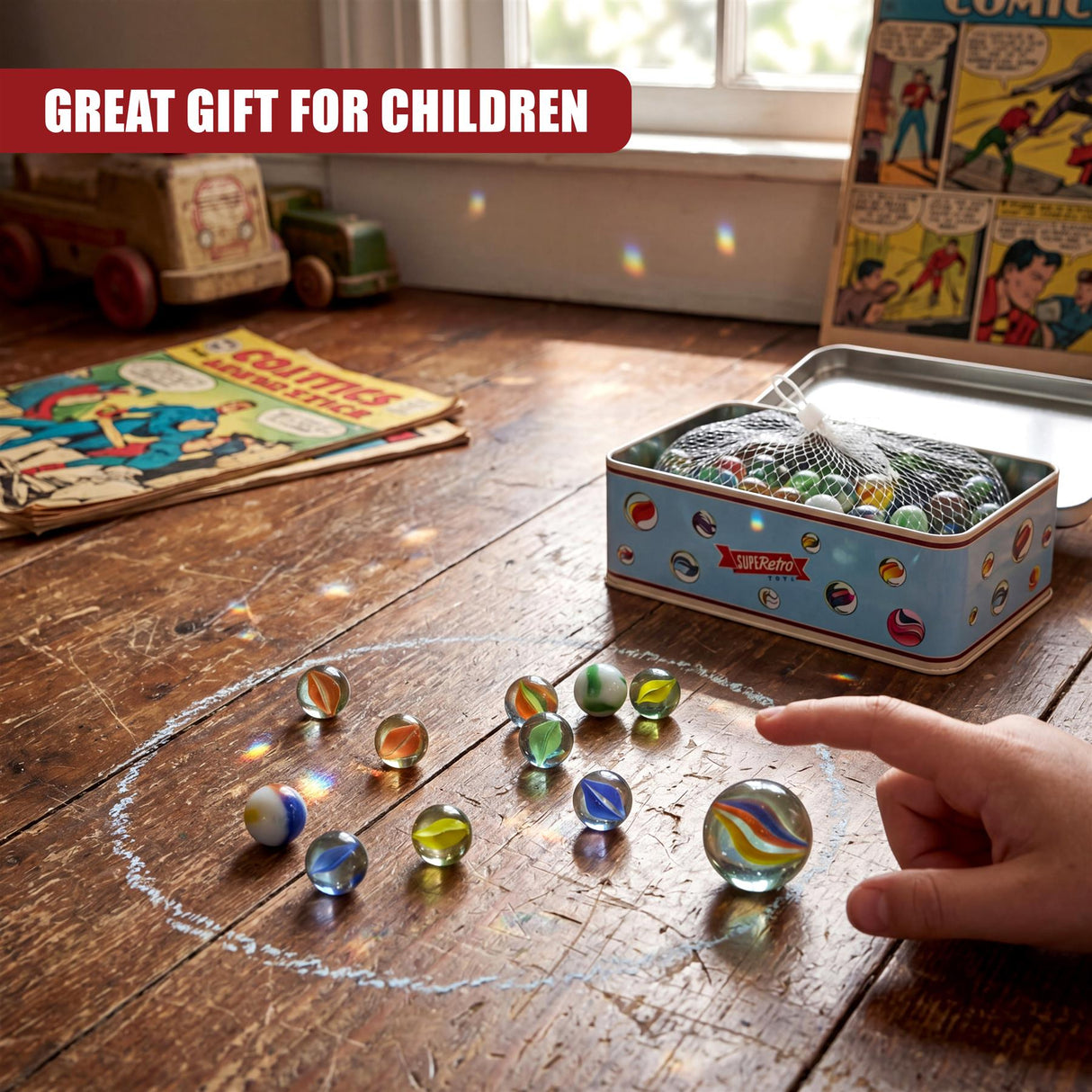 A hand points toward scattered, colorful glass marbles beside a marbled metal tin box.