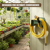 The mounted green holder stores a coiled yellow garden hose near a spigot on the wall.