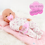 Doll with pacifier, wearing patterned clothes, accompanied by a pink baby bottle accessory.