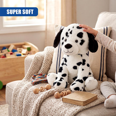 Dalmatian plush toy with a hand touching it, sitting among crocheted throw, wooden blocks, and books.