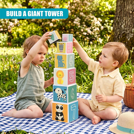 Two boys stack large, colorful alphabet and number blocks outdoors near a tree.