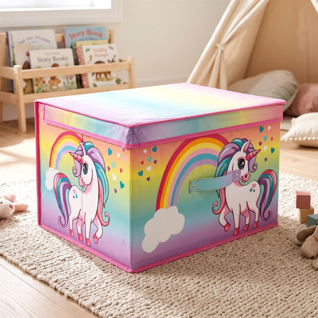 Rainbow Unicorn Storage Box from The Magic Toy Shop sits on a rug in a child's playroom, featuring rainbow and unicorn