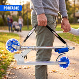 The adult holds a portable silver scooter featuring blue plastic wheels on a path.