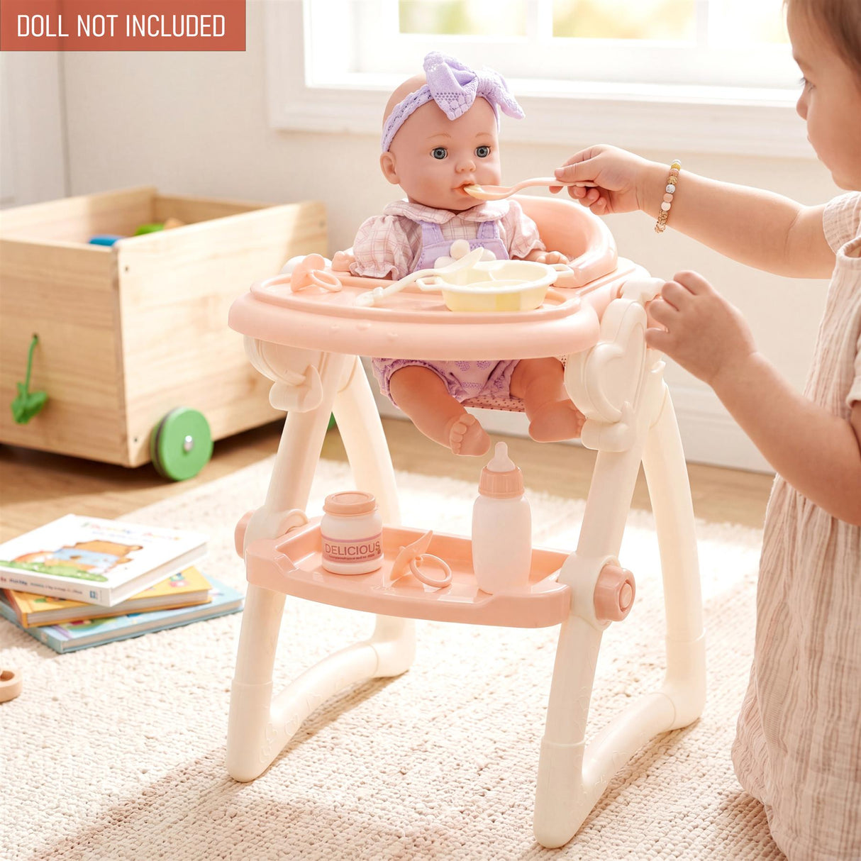 Light pink doll high chair set used by a child to feed a doll with various feeding accessories.