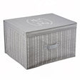 A gray fabric storage box with a heart pattern and "Neat and Tidy" on the lid
