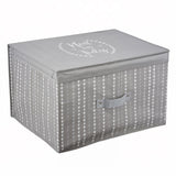 A gray fabric storage box with a heart pattern and "Neat and Tidy" on the lid