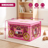 A pink princess carriage storage box with gold detailing sits on a rug in a child's room