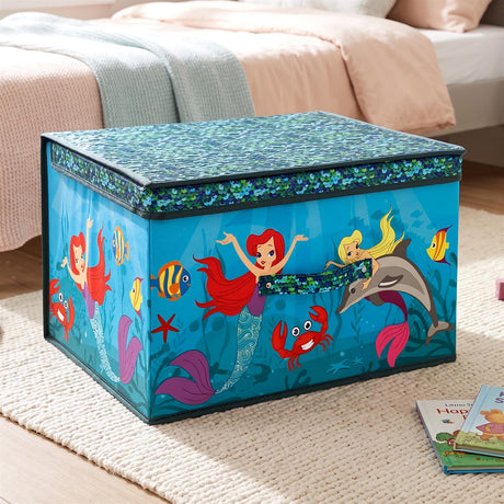 Blue storage box with mermaid and sea creature design on a bedroom floor