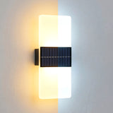 Horizontal wall light featuring illuminated acrylic panels and a dark rectangular accent module.
