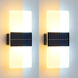 Pair of vertical wall sconces featuring illuminated acrylic panels and dark, slotted rectangular base fixtures.