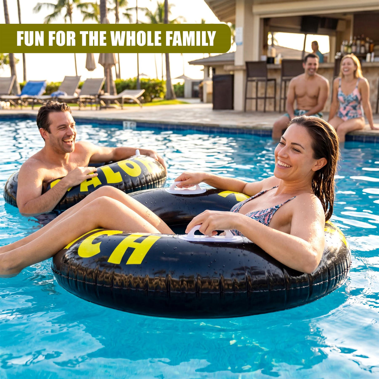 A black inflatable tire ring with yellow lettering floats in a blue swimming pool.