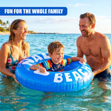Large blue inflatable ring spelling out "BEACH" floats in the water, being used by a child.