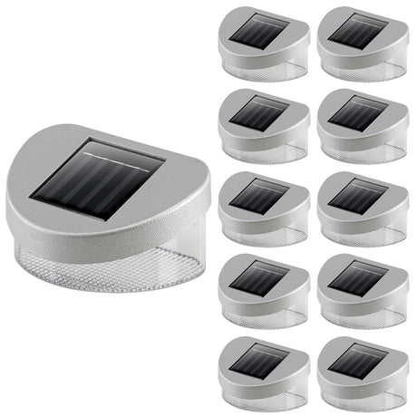 Multiple solar-powered LED fence lights with photovoltaic panels displayed in a grid arrangement.