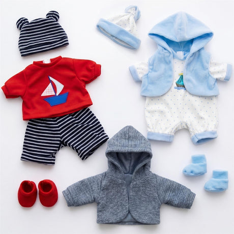 Flat lay of baby clothing set: red shirt, striped pants, blue romper, grey hooded cardigan, and booties.