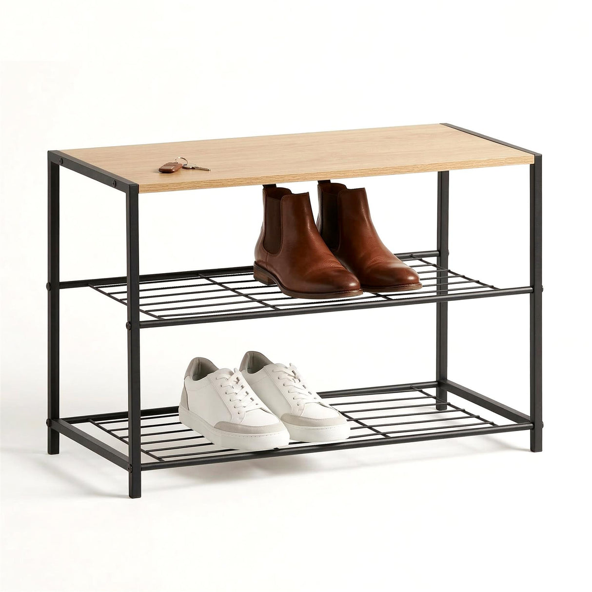 Black metal shoe rack displaying two pairs of boots and two pairs of sneakers on two tiers.