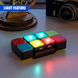 Handheld puzzle cube featuring illuminated sides, glowing with multiple colors of light.